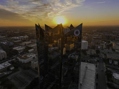 a drone image showing the Frost Bank Tower at sunset in downtown San Antonio, Texas